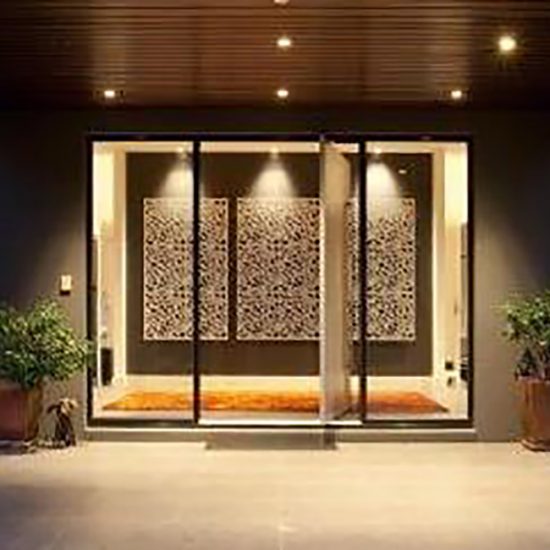 entry, formal entry, pivot door, pivot front door, metal wall panels, metal wall art, decorative screen, black wall, black wall paint