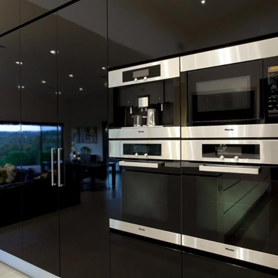 kitchen design, wall ovens, miele ovens, black cabinets, black gloss cabinets