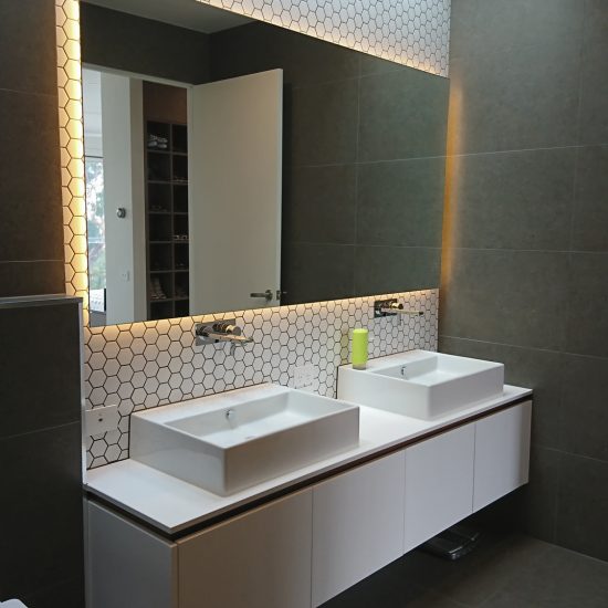 Bathroom design, contemporary bathroom, hexagonal mosaic tiles, feature tiles, floating vanity, custom joinery, backlit mirror, countertop basins